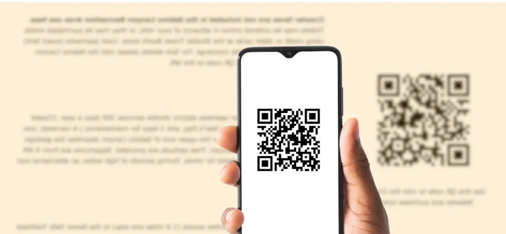 An example of a person using a phone to scan a QR code on the OYR kiosk screen.